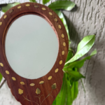 Handmade wooden handheld mirror with decorative brass inlay crafted by Indian artisans