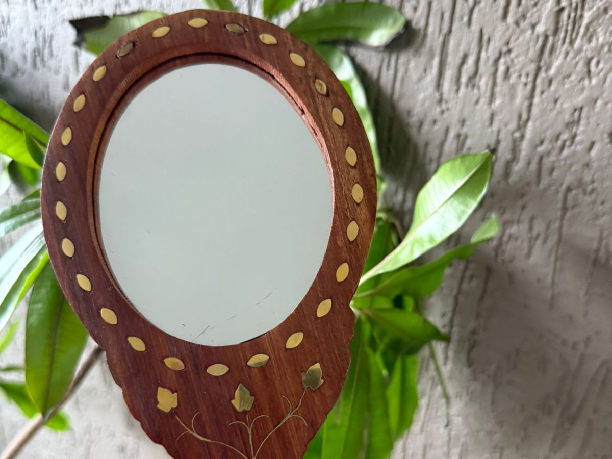 Handmade wooden handheld mirror with decorative brass inlay crafted by Indian artisans